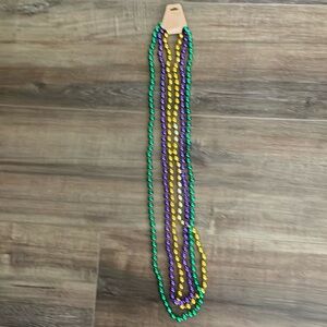 3 Mardi Gras plastic beads